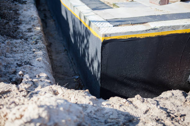Professional Waterproofing technician working in Fenton, MI
